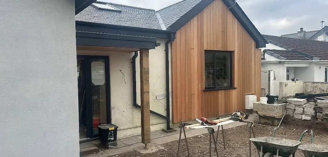 Cedar-clad extension and new porch nearing completion, a real Crews Carpentry job